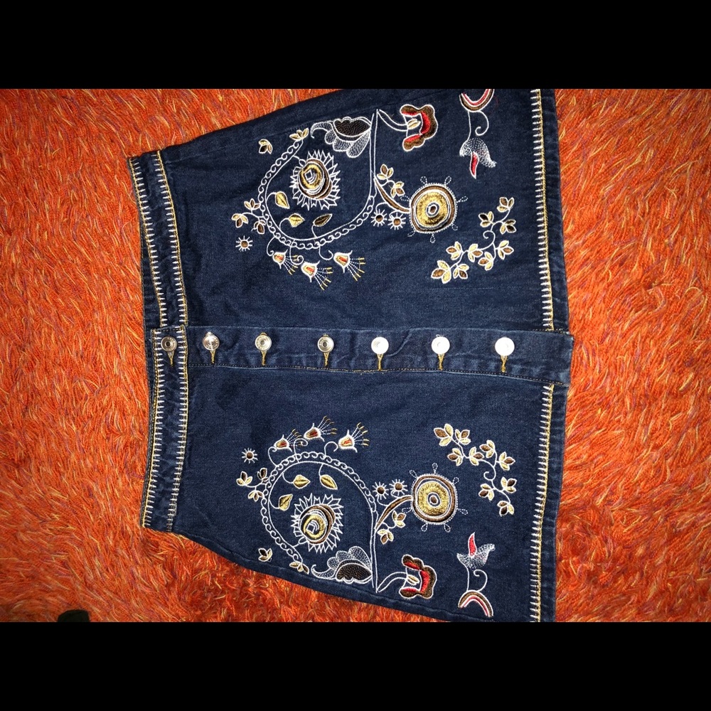 One of a kind embroidered denim skirt.